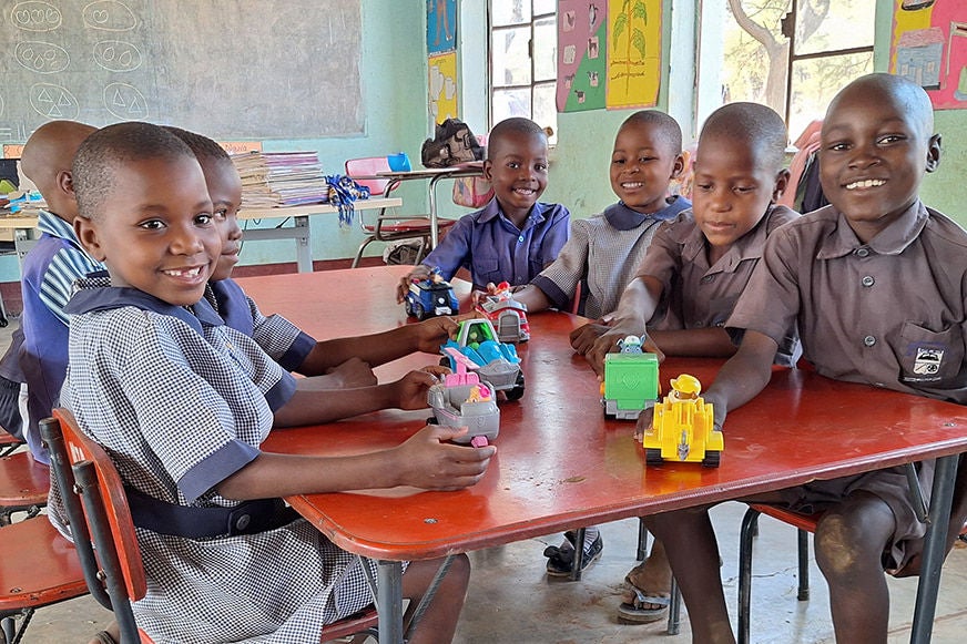children-playing-together-at-desk