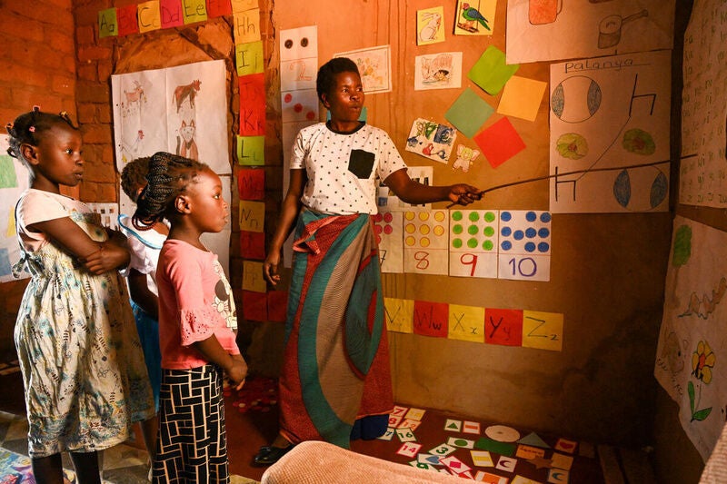 Teachers like Jemima Namumba in Zambia have seen a remarkable improvement in their students’ confidence and reading abilities with the help of World Vision's education programs. (Photo credit: Kambani Phiri / World Vision). 