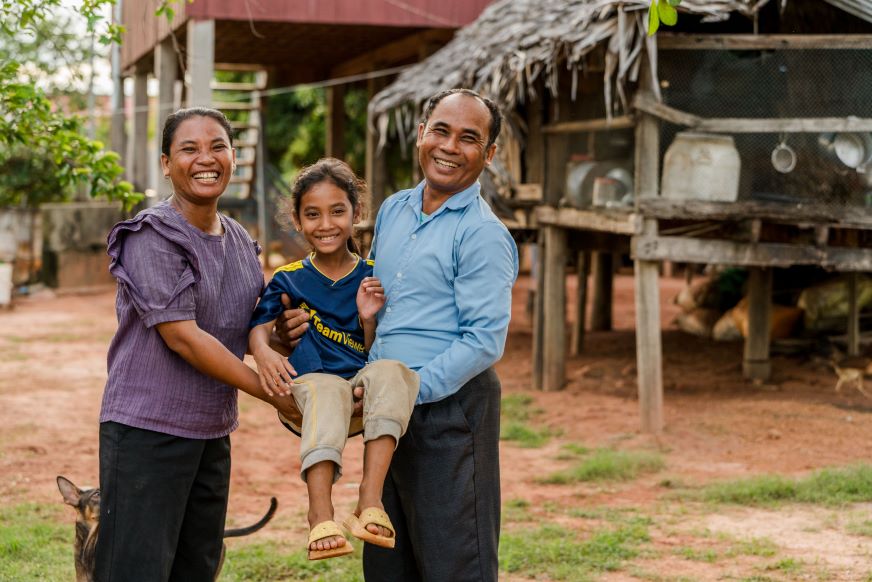 Cambodian parents Torn and Chern have seen their lives change after receiving positive parenting training through World Vision’s sponsorship program in their community. They learned about nonviolent discipline, mutual respect and family harmony. (Photo: World Vision/Amy Van Drunen)