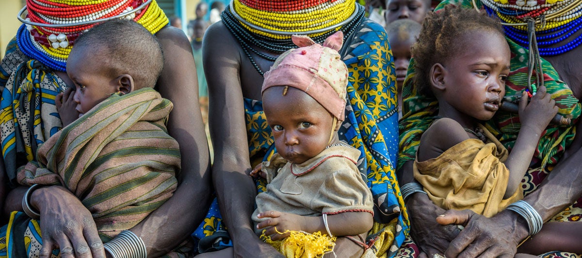 Children awaiting their checkup at a health clinic.