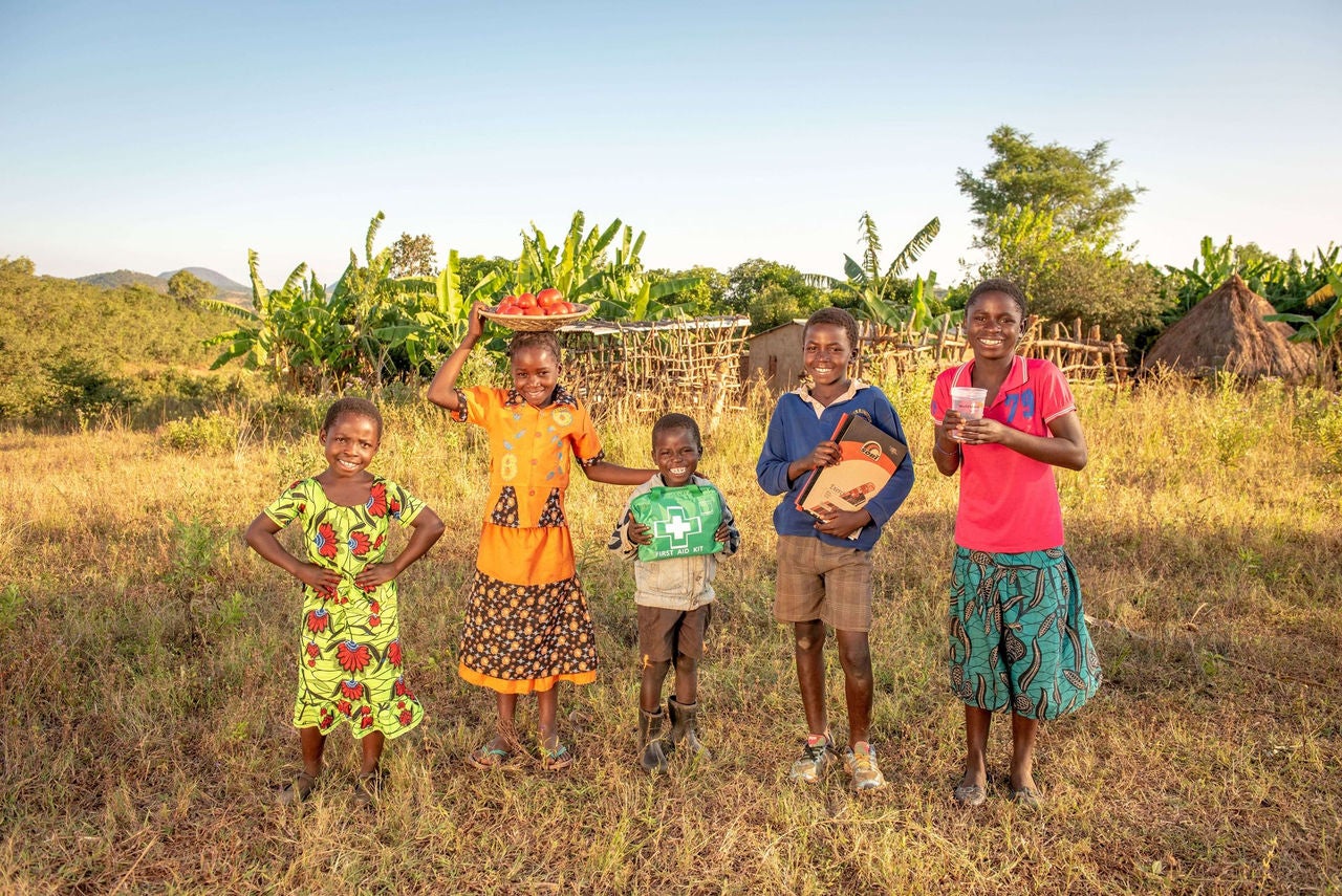 Five children standing in the field