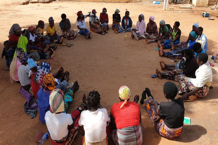 Participants sit in a circle.