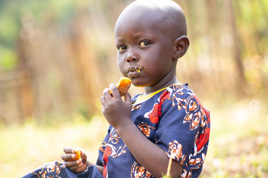 A child eats food.