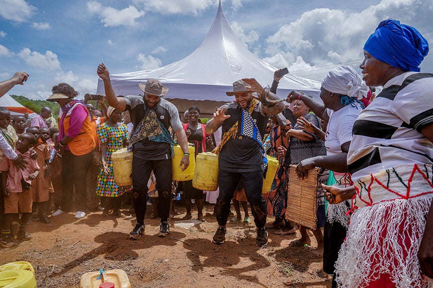 (CFL Players Brady Oliveira and Tyron Vrede, in Kenya)