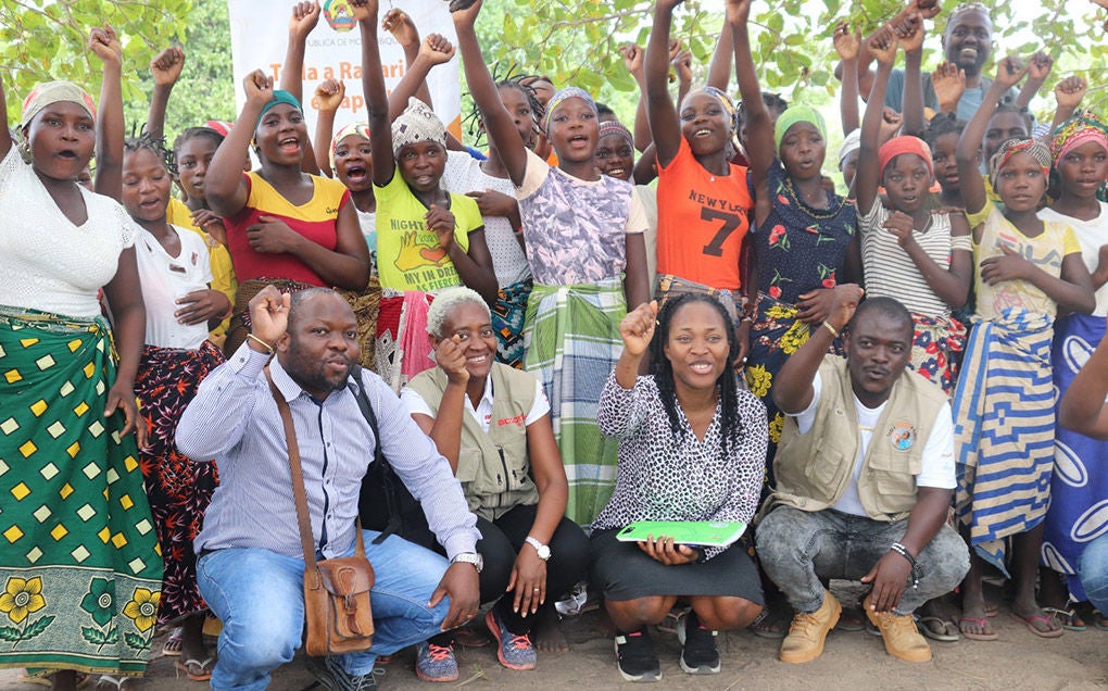 A group of people cheer.
