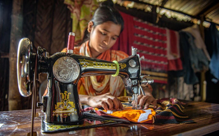 social-justice-guide-woman-working-with-sewing-machine
