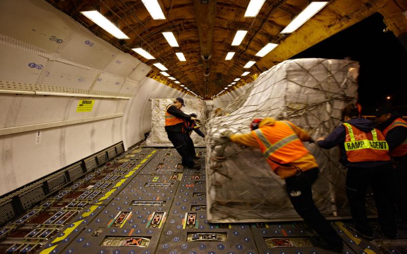 Emergency aid supplies being loaded onto a plane