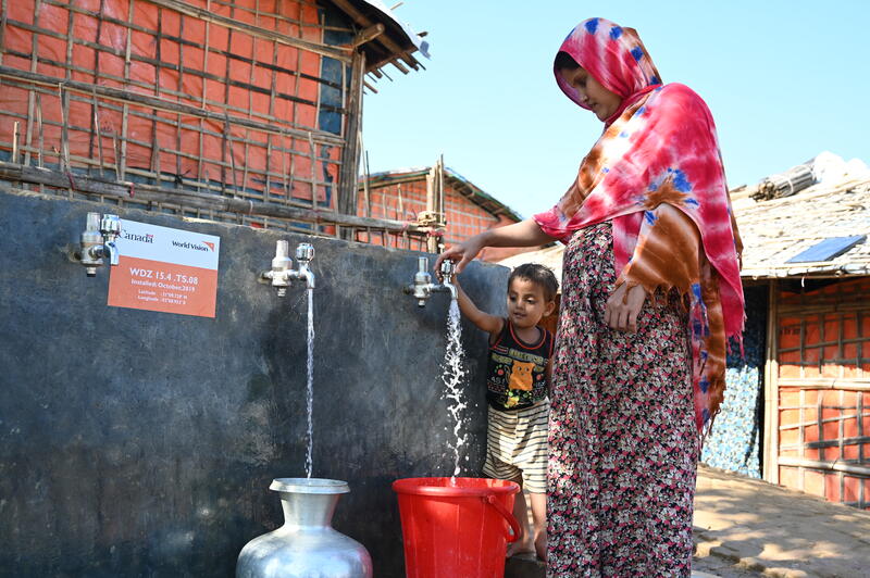 Shahanara, a Rohingya mother of three children, collects water from one of 30 water points in Camp 15 that provide chlorinated potable water to more than 1,000 refugee and host community families. World Vision installed the innovative solar-powered water network, funded by Global Affairs Canada.