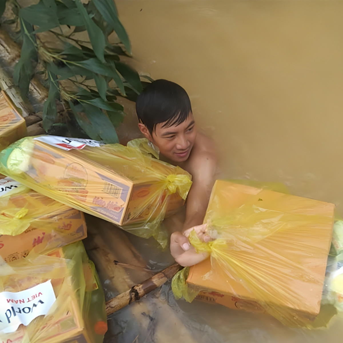 Emergency food supplies secured in plastic bags and boxes during flood disaster response.